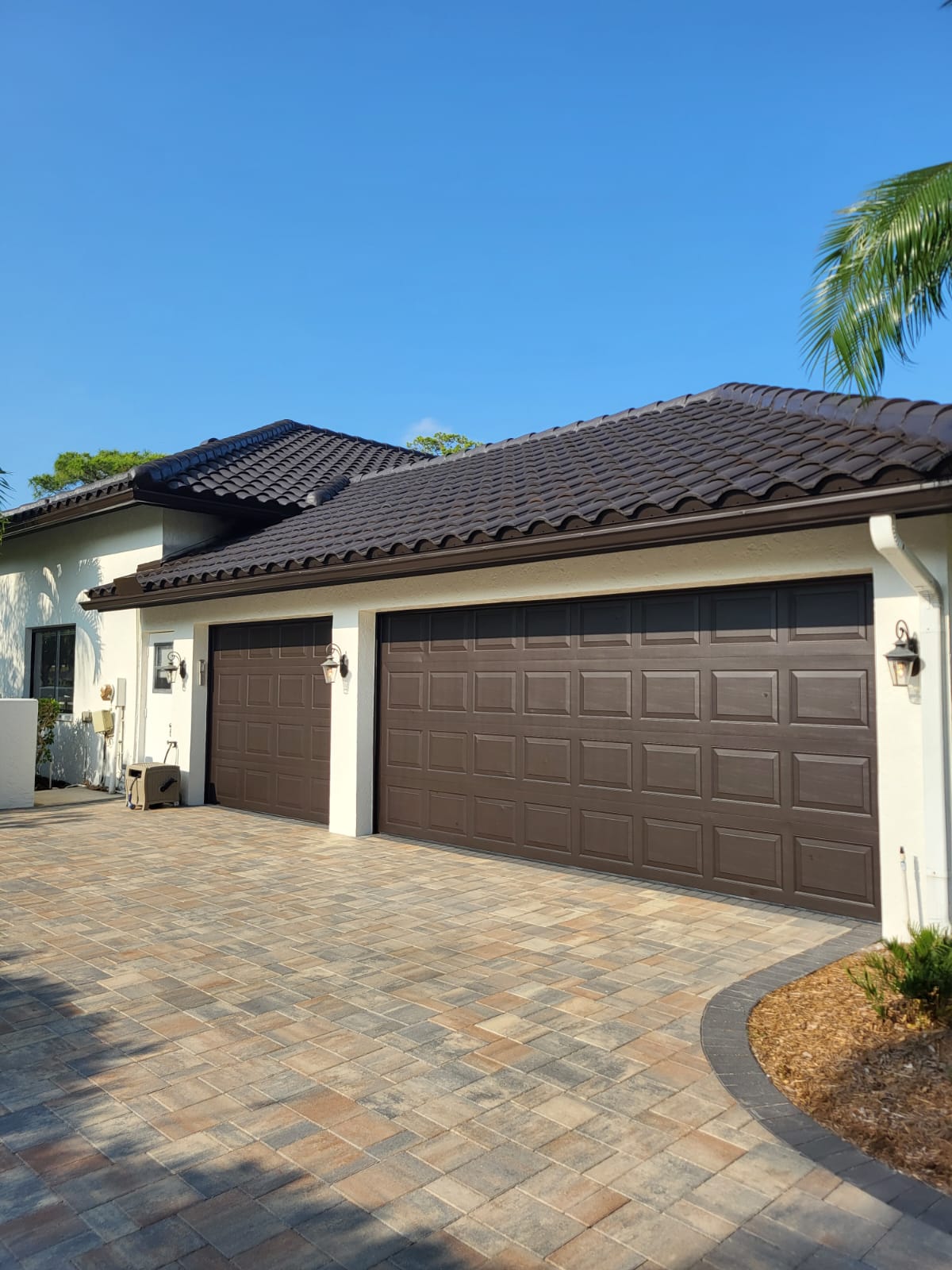 Repainted garage doors with rich brown finish